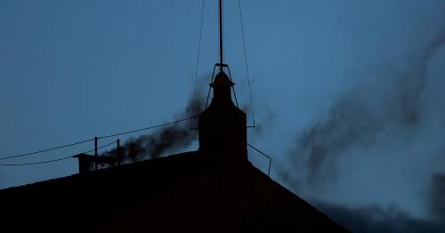 No Pope announcement yet as black smoke billows from